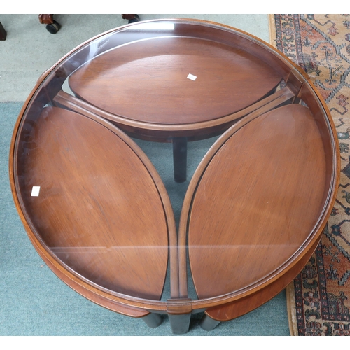 95 - A mid 20th century teak Nathan circular glass topped nesting coffee table, 51cm high x 82cm diameter