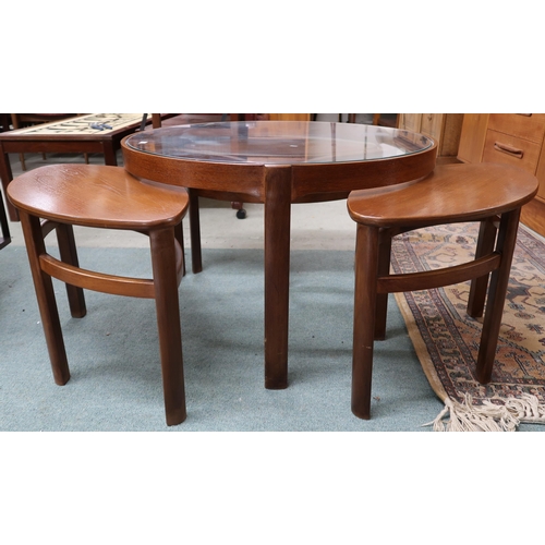 95 - A mid 20th century teak Nathan circular glass topped nesting coffee table, 51cm high x 82cm diameter