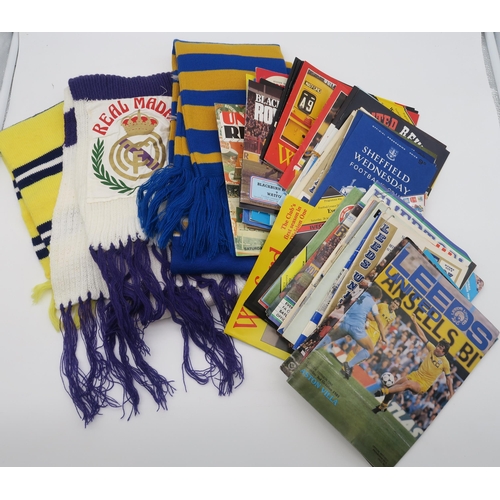 560 - A mixed collection of 1950s and later football memorabilia (scarves, programmes etc.), with teams to... 