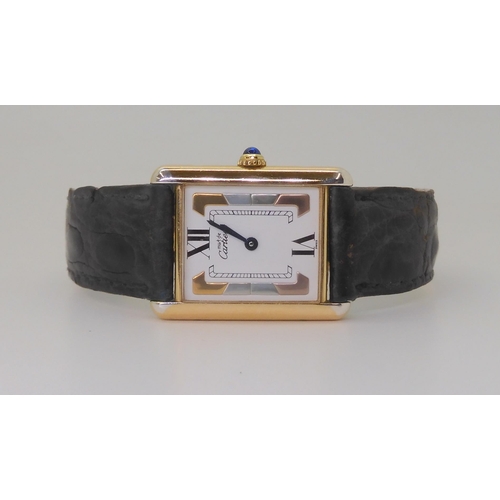 A LADIES MUST DE CARTIER TANK WATCHthis model has a three coloured