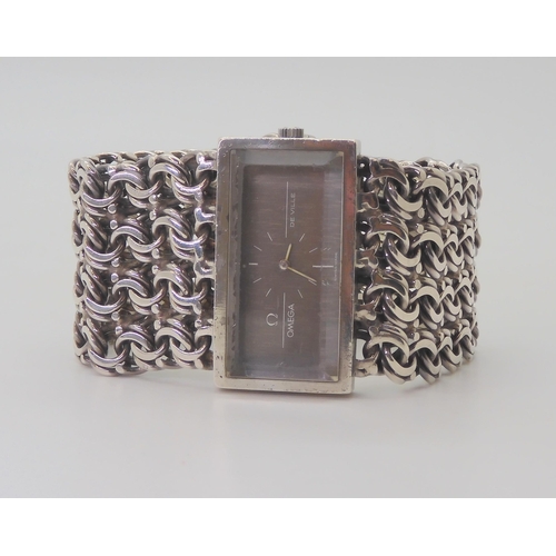 2892 - A SILVER RETRO LADIES OMEGA DE VILLEwith oblong case, grey textured dial with white logo and baton n... 