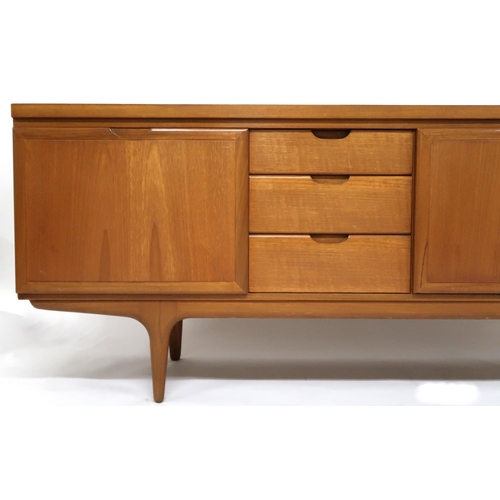 2120 - A MID 20TH CENTURY TEAK GREAVES & THOMAS SIDEBOARD with three drawers and fall front compar... 