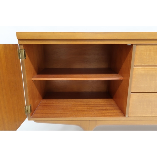 2120 - A MID 20TH CENTURY TEAK GREAVES & THOMAS SIDEBOARD with three drawers and fall front compar... 