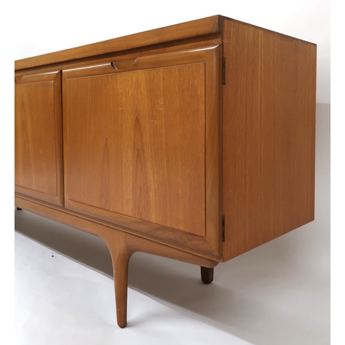 2120 - A MID 20TH CENTURY TEAK GREAVES & THOMAS SIDEBOARD with three drawers and fall front compar... 