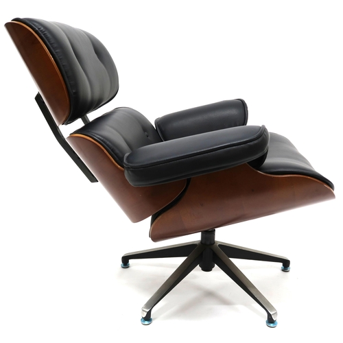 2123 - A 20TH CENTURY AFTER CHARLES & RAY EAMES LOUNGE CHAIR with buttoned black vinyl upholstered cush... 