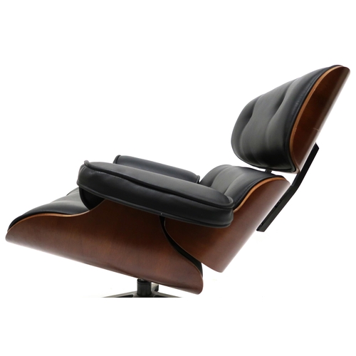 2123 - A 20TH CENTURY AFTER CHARLES & RAY EAMES LOUNGE CHAIR with buttoned black vinyl upholstered cush... 