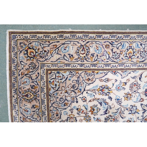 2137 - A CREAM GROUND TABRIZ RUG with blue and beige central medallion, matching spandrels and beige flower... 