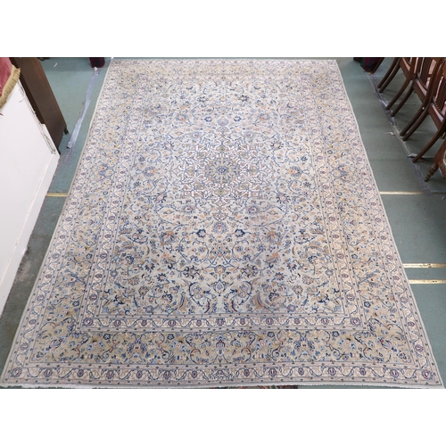 2138 - A PALE BLUE GROUND KASHAN RUG with cream and beige central medallion, floral pattern ground and beig... 