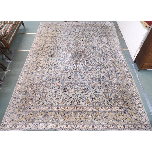 2138 - A PALE BLUE GROUND KASHAN RUG with cream and beige central medallion, floral pattern ground and beig... 