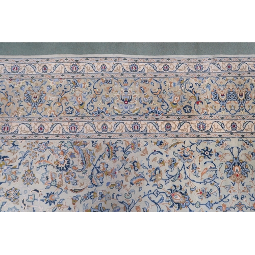 2138 - A PALE BLUE GROUND KASHAN RUG with cream and beige central medallion, floral pattern ground and beig... 