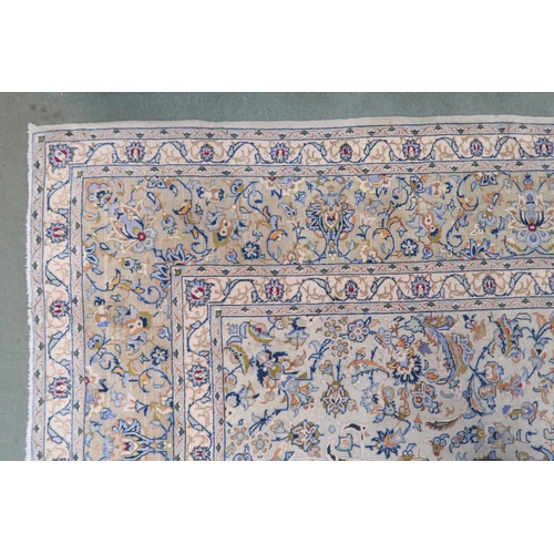 2138 - A PALE BLUE GROUND KASHAN RUG with cream and beige central medallion, floral pattern ground and beig... 