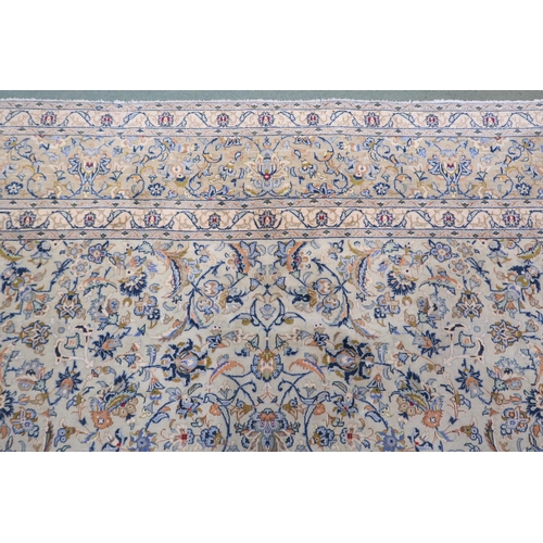 2138 - A PALE BLUE GROUND KASHAN RUG with cream and beige central medallion, floral pattern ground and beig... 