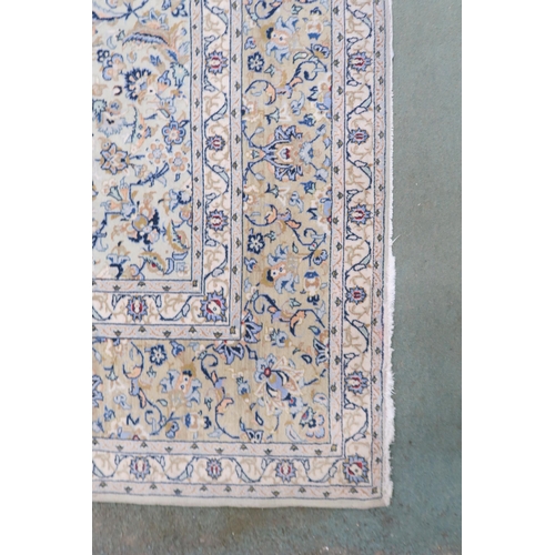 2138 - A PALE BLUE GROUND KASHAN RUG with cream and beige central medallion, floral pattern ground and beig... 