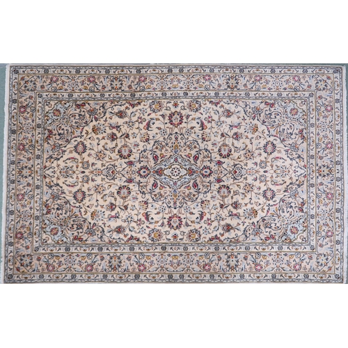 2139 - A CREAM GROUND KESHAN RUG with pale blue diamond shaped central medallion, matching spandrels on mul... 