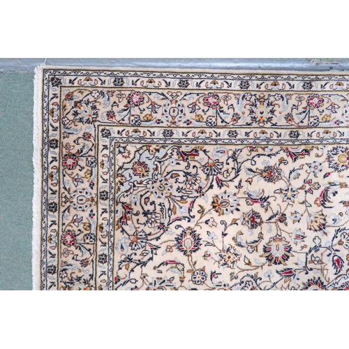 2139 - A CREAM GROUND KESHAN RUG with pale blue diamond shaped central medallion, matching spandrels on mul... 