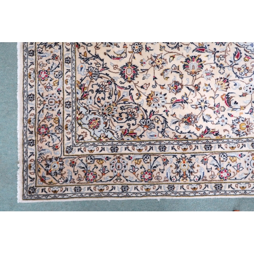 2139 - A CREAM GROUND KESHAN RUG with pale blue diamond shaped central medallion, matching spandrels on mul... 