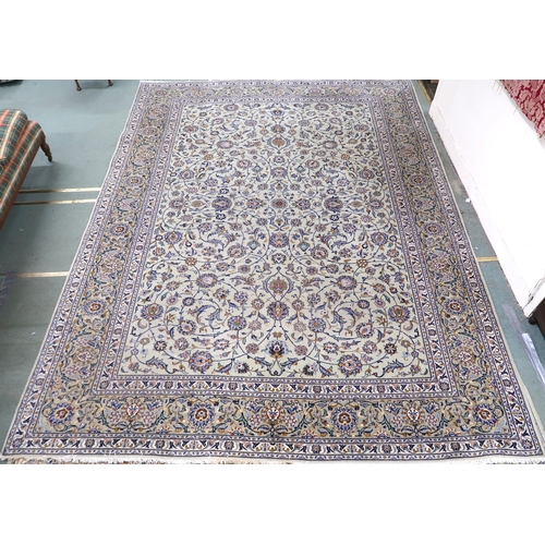 2140 - A PALE GREEN GROUND KASHAN RUG with all over floral pattern ground and multicoloured flower head bor... 