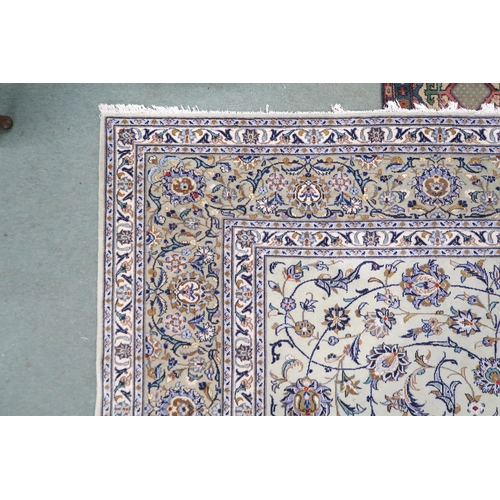 2140 - A PALE GREEN GROUND KASHAN RUG with all over floral pattern ground and multicoloured flower head bor... 