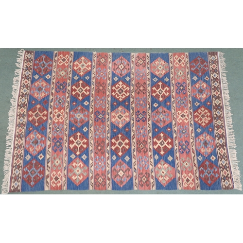 2141 - A MULTICOLOURED GROUND KILIM RUG with all over banded design with geometric medallions, 275cm long x... 