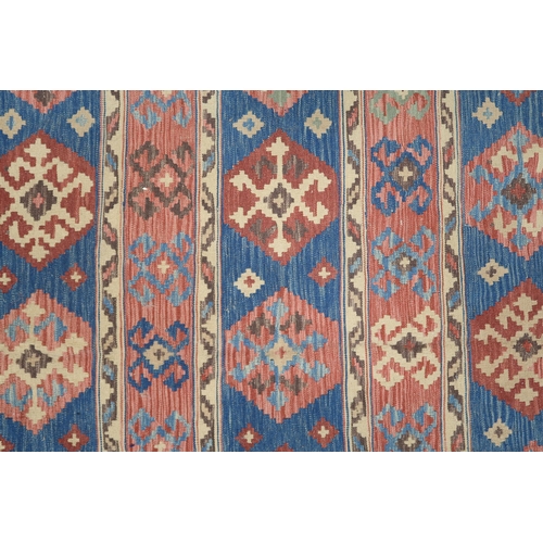 2141 - A MULTICOLOURED GROUND KILIM RUG with all over banded design with geometric medallions, 275cm long x... 