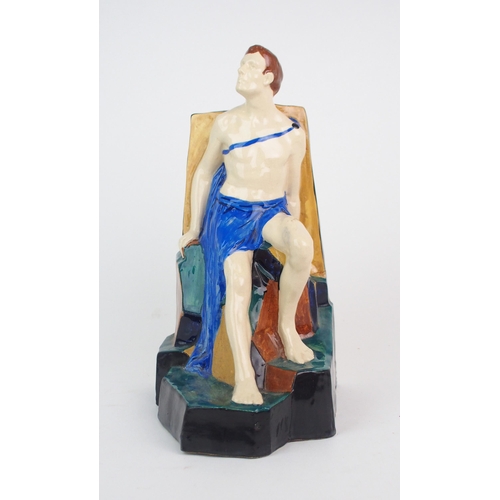 2164 - MAJEL DAVIDSON (1885-1969) a ceramic figure of a seated man wearing a tunic, signed M Davidson to ba... 