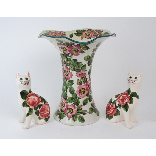 2185 - A WEMYSS LADY EVA VASE painted with dog roses, 30cm high together with a pair of Griselda Hill rose ... 