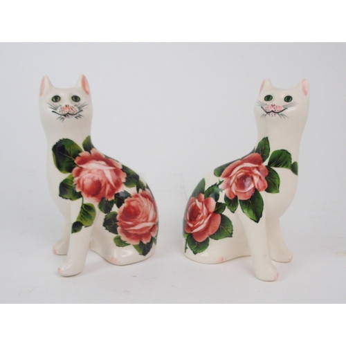 2185 - A WEMYSS LADY EVA VASE painted with dog roses, 30cm high together with a pair of Griselda Hill rose ... 