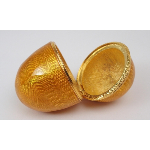 2196 - A FABERGE MENAGERIE COLLECTION SURPRISE EGG the yellow guilloche enamelled egg with hand-carved hard... 
