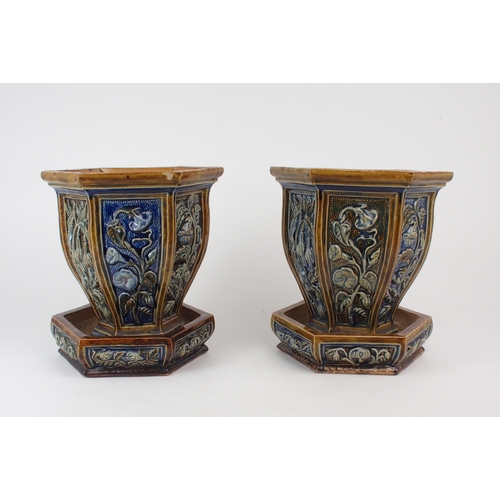 2199 - A PAIR OF UNMARKED DOULTON STONEWARE JARDINIERES AND SAUCERS each of hexagonal form with panels of f... 