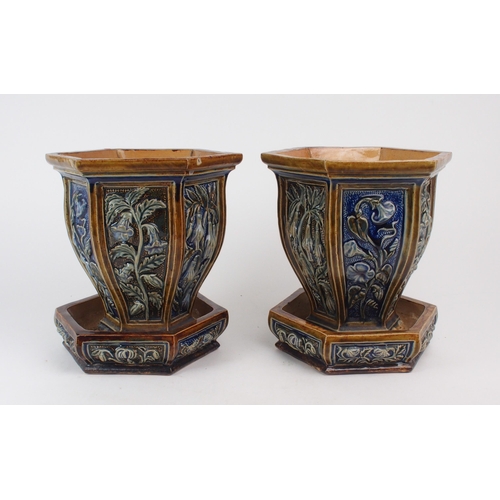 2199 - A PAIR OF UNMARKED DOULTON STONEWARE JARDINIERES AND SAUCERS each of hexagonal form with panels of f... 