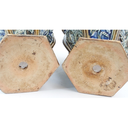 2199 - A PAIR OF UNMARKED DOULTON STONEWARE JARDINIERES AND SAUCERS each of hexagonal form with panels of f... 