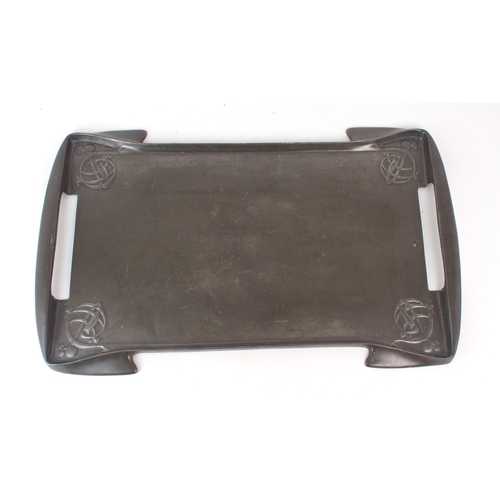 2217 - ARCHIBALD KNOX (1864-1933) FOR LIBERTY & CO an English pewter tray of rectangular shape, with cu... 