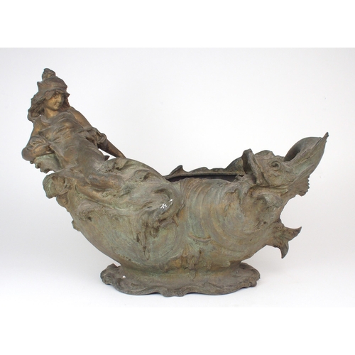 2218 - A SPELTER JARDINIERE moulded with a reclining maiden amongst waves with a fish to the other end, ind... 