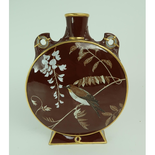 2239 - A MINTON ART STUDIO POTTERY MOON FLASK painted to one side with a bird amongst wisteria, and with a ... 