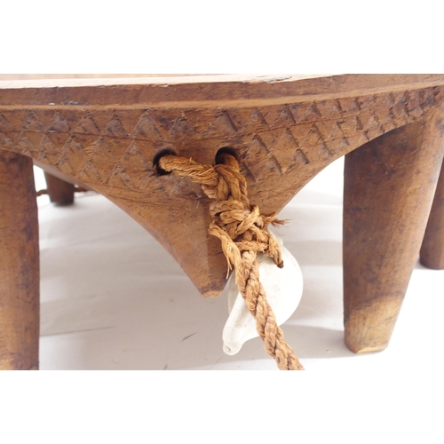 2356 - A POLYNESIAN KAVA HARDWOOD BOWLwith coconut fibre sennit cord and cowrie shells, surrounding a deep ... 