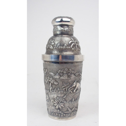 2375 - AN INDIAN SILVER COCKTAIL SHAKER Decorated with figures, elephant, ducks, mountains and foliage, wit... 