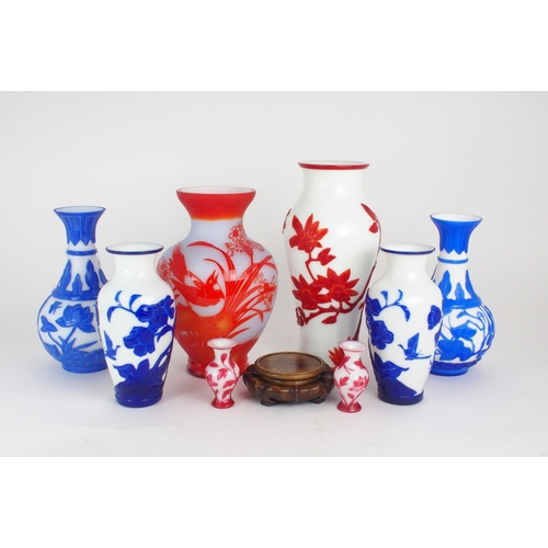 2393 - A COLLECTION OF MODERN PEKING GLASSincluding a pair of cobalt blue overlay examples, carved with flo... 