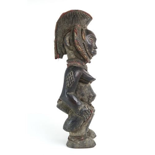 2396 - A CARVED HARDWOOD FEMALE FIGURE, CONGOAugmented with fabric-covered grass banding, measuring approx.... 