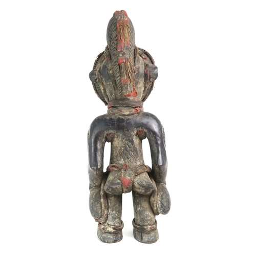 2396 - A CARVED HARDWOOD FEMALE FIGURE, CONGOAugmented with fabric-covered grass banding, measuring approx.... 