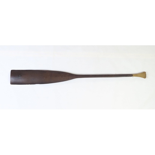 2397 - A PALMWOOD PADDLE, NEW IRELANDThe flared pommel with woven fibre covering, measuring approx. 99.5cm ... 