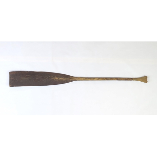 2397 - A PALMWOOD PADDLE, NEW IRELANDThe flared pommel with woven fibre covering, measuring approx. 99.5cm ... 