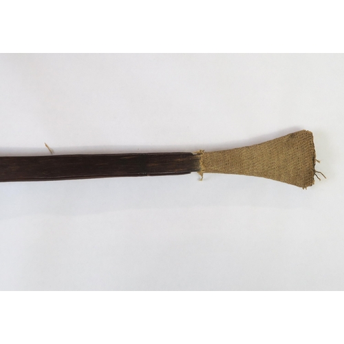 2397 - A PALMWOOD PADDLE, NEW IRELANDThe flared pommel with woven fibre covering, measuring approx. 99.5cm ... 