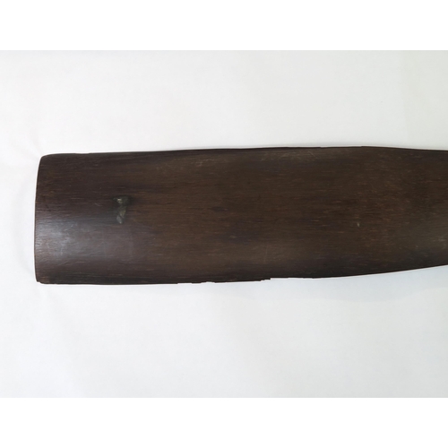 2397 - A PALMWOOD PADDLE, NEW IRELANDThe flared pommel with woven fibre covering, measuring approx. 99.5cm ... 