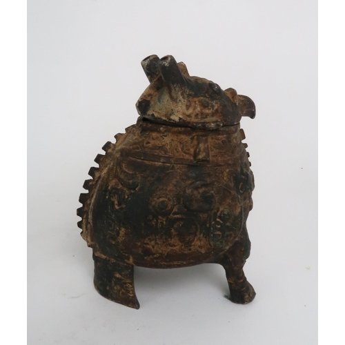 2402 - A BRONZE WARRIOR ON HORSEBACK27cm high and an Archaic style grotesque animal censer, 17.5cm high (2)... 