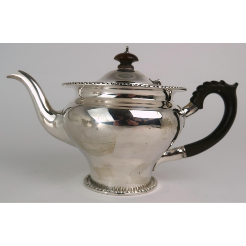 2469 - AN EDWARDIAN BACHELORS SILVER TEA SERVICEmaker's mark rubbed, London 1911, of baluster form, with a ... 