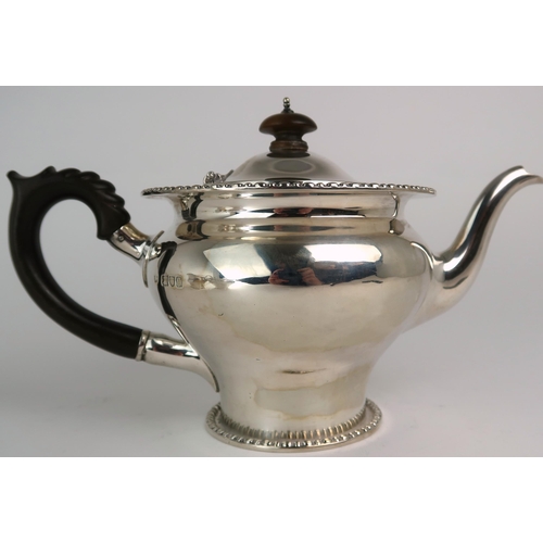 2469 - AN EDWARDIAN BACHELORS SILVER TEA SERVICEmaker's mark rubbed, London 1911, of baluster form, with a ... 