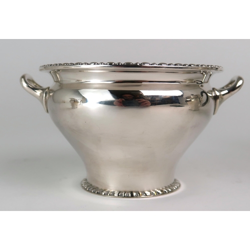 2469 - AN EDWARDIAN BACHELORS SILVER TEA SERVICEmaker's mark rubbed, London 1911, of baluster form, with a ... 