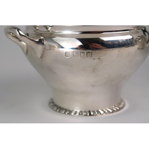 2469 - AN EDWARDIAN BACHELORS SILVER TEA SERVICEmaker's mark rubbed, London 1911, of baluster form, with a ... 