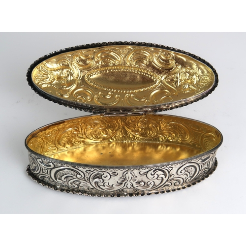 2472 - A VICTORIAN SILVER JEWELLERY BOXby Robert Humphries, London 1881, of oval form, with moulded scrolli... 