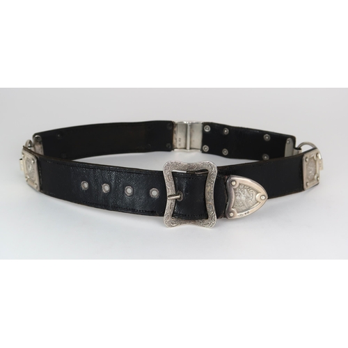 2476 - A VICTORIAN SILVER MOUNTED BLACK LEATHER BELTby Thomas Johnson I, London 1874, the panels decorated ... 